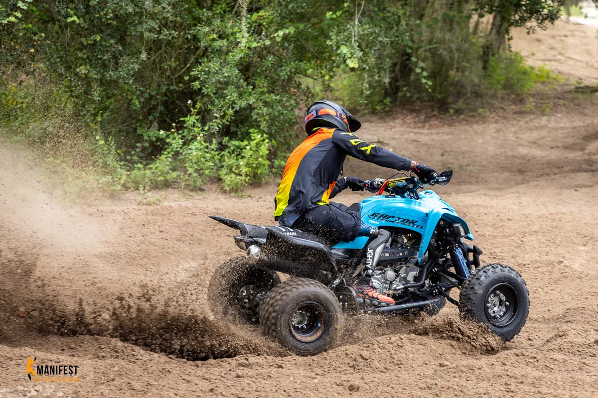 Isaac Marrero riding an ATV with his custom-built Manifest prosthetic leg.